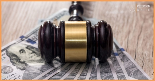 Gavel on top of money